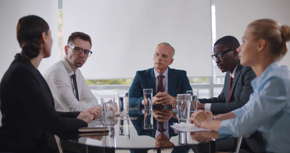 Business,Leader,Holding,Corporate,Meeting,With,Team,In,Boardroom.,Multiracial