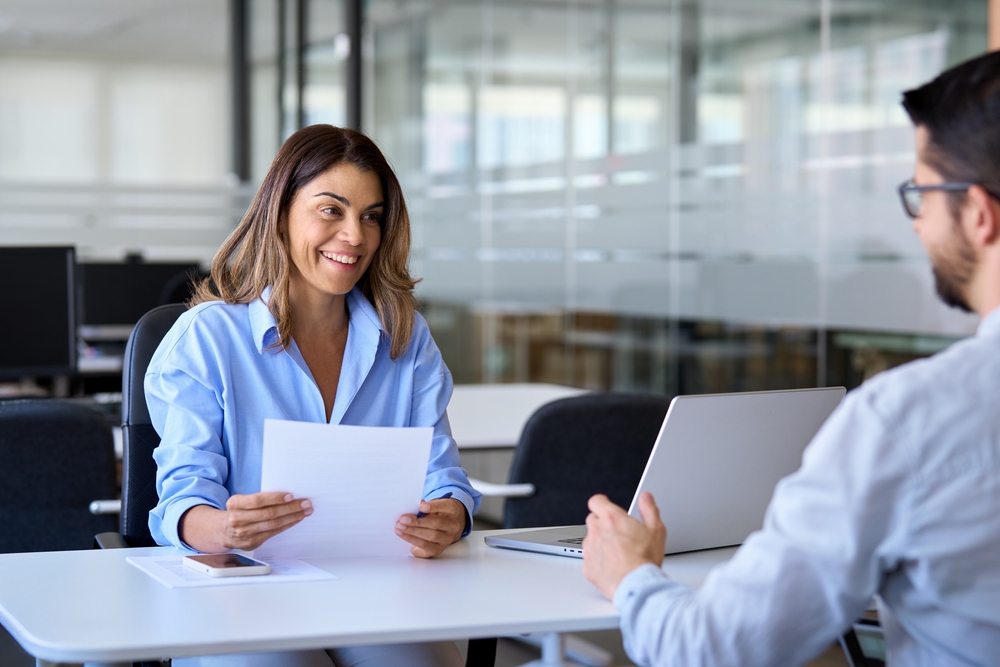 Executive interviewing a candidate as part of a talent acquisition strategy
