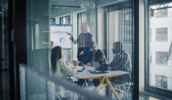 leadership team reviewing customer revenue growth strategy
