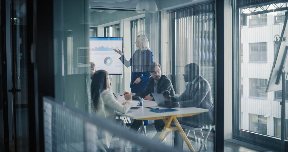 leadership team reviewing customer revenue growth strategy